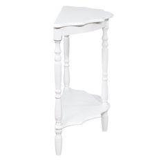 a small white table with one shelf on the side