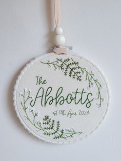 The perfect wedding gift - a custom hoop with the happy couple's name and wedding date. Framed with Gypsophilia and Ferns, a beautiful floral keepsake they can hang in their home. It's the perfect present for an anniversary especially that second cotton anniversary as 100% cotton is used for all hoops. There are 2 hoop sizes to choose from; 6" & 8". Hand embroidered on 100% cotton fabric. Please note as each one is made to order they may vary slightly from photos. **Leave a note in the descripti Wedding Gift Embroidery Ideas, Wedding Gift Painting, Wedding Gift Embroidery, Wedding Gifts Painting, Embroidery For Wedding, Embroidered Wedding Gifts, Present For Friend, Floral Themed Wedding, Friend Anniversary