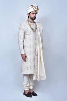 Cream sherwani with floral embroidered motifs and welt pocket in front. Comes with cream churidar and border embroidered dupatta.
Components: 3
Pattern: Embroidery
Type Of Work: Thread
Neckline: Mandarin Collar
Sleeve Type: Long
Fabric: Art Silk, Silk Blend
Color: Cream
Other Details: 
Welt pocket in front
Slits on the sides
Closure: Button front
Note: The mala and safa worn by the model is not for sale
Occasion: Groom - Aza Fashions Cream Sherwani, Cream Art, Embroidered Motifs, Rohit Bal, Tarun Tahiliani, Embroidered Dupatta, Thread Art, Pattern Embroidery, Silk Embroidery