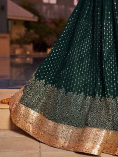 Introducing our stunning green sequins georgette reception wear lehenga choli, a perfect attire for weddings, functions, and other ethnic occasions. Made from high-quality georgette material, this exquisite set includes a green color lehenga with sequin work and thread embroidered work, a matching choli, and a dupatta with sequin work, thread embroidery, and attractive lace border work. The lehenga is semi-stitched up to 42 inches, while the choli comes with 1-meter un-stitched material and the Green Color Lehenga, Engagement Gown, Lehenga Crop Top, Georgette Material, Lehenga Choli Wedding, Floral Lehenga, Party Wear Lehenga Choli, Reception Gown, Bollywood Lehenga