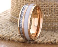 two tone gold and white ceramic wedding ring with silver inlays on the inside