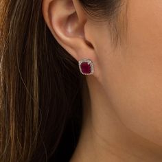 Define classic and sophistication with these bright red lab-created ruby and white lab-created sapphire cushion frame stud earrings. Fashioned in sterling silver Each earring features an 8.0 x 6.5mm emerald-cut red lab-created ruby. A cushion-shaped frame of white lab-created sapphires embraces the center in shimmer. These post earrings secure comfortably with friction backs. Classic Evening Ruby Jewelry, Elegant Gemstone Earrings With Lab-created Ruby, Classic Halo Setting Jewelry With Lab-created Ruby, Elegant Lab-created Ruby Earrings For Anniversary, Elegant Jewelry With Lab-created Ruby Gemstone, Formal Ruby Jewelry With Pave Setting, Red Pave Setting Jewelry Gift, Red Pave Setting Jewelry For Gift, Classic Red Jewelry With Pave Setting