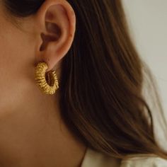 The Paola Sighinolfi Amulet Earrings stand out for their personality and character. These handmade textured mini hoops are sure to be your new go to's 18k Gold Plated 2cm Made in Spain Textured Small Hoop Yellow Gold Earrings, Textured Gold-plated Hoop Earrings, Textured Small Hoop Jewelry For Gifts, Textured Gold Plated Hoop Earrings, Textured Gold Plated Yellow Gold Jewelry, Textured Small Hoop Jewelry Gift, Textured Gold-plated Yellow Gold Jewelry, Textured Yellow Gold-plated Jewelry, Textured Yellow Gold Plated Jewelry