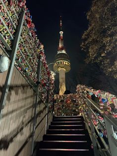 the stairs leading up to the tower are decorated with christmas decorations