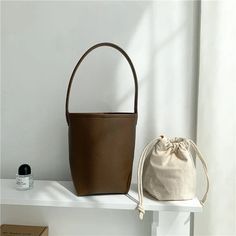 Length :16cm width :11cm height :21.5cm Beige Bucket Box Bag With Large Capacity, Large Capacity Beige Bucket Box Bag, Beige Everyday Bucket Box Bag, Beige Bucket Box Bag For Everyday, Everyday Beige Bucket Box Bag, Khaki Bucket Bag With Double Handle For Daily Use, Khaki Double Handle Bucket Bag For Daily Use, Beige Bucket Shoulder Bag For Daily Use, Everyday Beige Bucket Baguette Bag