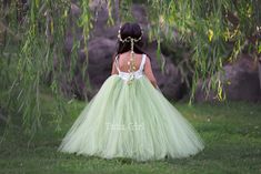 "Sweet simplicity! Our unique full and fluffy tulle dress feature a lined ivory satin sleeveless bodice with an OLIVE GREEN tutu style skirt. The back of the dress bodice is stretchy for a custom, yet versatile, comfort fit. Want a WHITE or OFF-WHITE (LIGHT IVORY) bodice instead. We can change these colors! WANT A SEWN IN SLIP TO LINE THE TUTU? https://www.etsy.com/listing/125566641/add-a-slip-to-the-tutu-dress-sewn-in At checkout, please give us the following information: HOW TO ORDER: IMPORTAN Light Green Flower Girl Dresses, Communion Dresses Lace, Prom Dress Short Lace, Green Flower Girl Dresses, Blush Flower Girl Dresses, Flower Girl Outfit, Long Flower Girl Dresses, Tulle Flower Girl Dress, Green Tulle