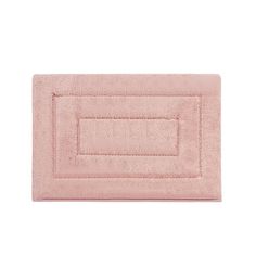 a pink bath rug on a white background