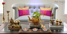 a living room filled with lots of furniture and decor on top of a wooden table