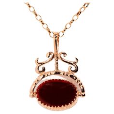 The Callie Pendant & Chain is a gorgeous vintage adornment that ribbons and scrolls its way to a spinner of crimson carnelian and onyx. Her precious gems are embraced by beautiful garlands of flowers carved into 9 carat rose gold. The Callie Pendant Gem Details The carnelian cabochon is an orange red colour and measures 17.4x12.4 millimetres.The black onyx cabochon measures 17.4x12.4 millimetres. Size The pendant measures approximately 23.9x13.9 millimetres, and the length of the chain is approximately 50 centimetres. Condition Vintage. Circa 1980s. Great to know The Callie Pendant & Chain belongs to our treasure trove of strongly sustainable, ethical, environmentally friendly, and conflict-free jewellery. She lives in our carefully curated collection of one of a kind vintage jewellery pie Blink Blink, Red Colour, Flower Garlands, Precious Gems, Vintage Jewellery, Free Jewelry, Orange Red, Black Onyx, Environmentally Friendly