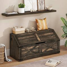 a wooden box sitting on top of a hard wood floor next to a potted plant