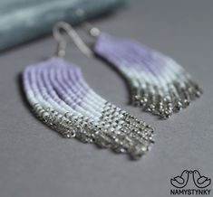 These light purple beaded earrings are made of high-quality Czech beads and strong synthetic thread. They are elegant, fashionable, and highly versatile, suitable for everyday wear. Features: Sterling silver components Color: purple, white, silver. This item is currently in stock. You must be completely satisfied. If you find merchandise unsatisfactory for any reason, return it within 10 days and your money will be refunded without questions. More beaded earrings http://etsy.me/2ycItdb Gerdan ne Purple Beaded Earrings, Violet Earrings, Lilac Earrings, Purple Beaded, Bead Work Jewelry, Earrings Long, Coral Beads, Seed Bead Earrings, Czech Beads