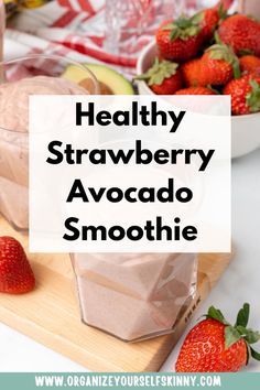 healthy strawberry smoothie with strawberries in the background and text overlay that reads healthy strawberry avocado smoothie