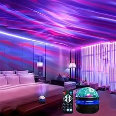 a bedroom with purple and blue lights on the ceiling