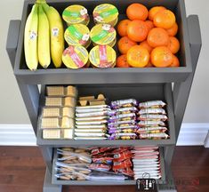 an assortment of food is displayed on a shelf