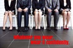 four business people sitting on chairs with their legs crossed