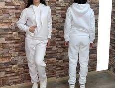 FREE EXPRESS SHIPPING for all United State orders over $35* Two Piece Tracksuit Outfit with Hoodie and Pockets / Two Piece Athletic Set / Аthletic Wear / Athletic Pants / Athletics Hoodie Three-piece set. High-waisted trousers with built-in elastic. Side pockets and wide legs. Impressive crop top with short sleeves and a round neckline. Comfortable blouse with a loose silhouette. Wide, loose sleeves and turtleneck. Asymmetric hem. Materials: cotton This dress is perfect for different events, parties, dinners and hangouts. ♥ THE PERFECT GIFT FOR YOUR LOVED ONE ♥ ♥ All garments are handmade in our little Boutique in a special UNIQUE way ♥ Different sizes available. Check the listing for your size. * SOME PLUS SIZES ARE ALSO AVAILABLE SIZE CHART How to measure yourself * Bust: * Use a flexibl Outfit With Hoodie, Sweater Two Piece Set, Comfortable Blouses, Tracksuit Outfit, United State, Womens Sports, Loose Sleeves, Wide Legs, Athletic Pants