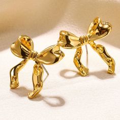 Product information: Treatment Process: Electroplating Color: gold, silver Material: Alloy Shape: Bow Packing list: A pair of earrings Product Image: Studded Nails, Knot Studs, Color Earrings, Stil Elegant, Bow Earrings, Bow Design, Accessories Jewelry Earrings, Stainless Steel Earrings, Simple Earrings