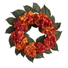 an orange wreath with green leaves and flowers