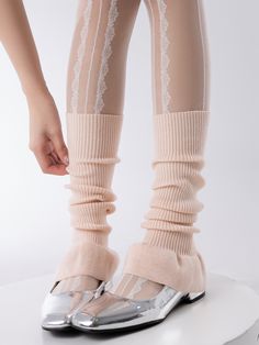 Elevate your look with these ballet-inspired leg warmers. Crafted in a solid color, these knit leg warmers add a touch of elegance to any outfit. The flared design at the bottom gives them a stylish and feminine touch.   Please note that this product includes one pair of leg warmers only. Stretch Knee-high Leg Warmers For Spring, Elastic Footless Leg Warmers, Cozy Stretch Legwear For Fall, Trendy Pink Footless Leg Warmers, Solid Color Footless Leg Warmers For Spring, Fitted Knit Socks For Fall, Solid Footless Leg Warmers For Fall, Trendy Knitted Socks For Spring, Fitted Thigh-high Leg Warmers For Spring