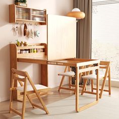 a wooden desk with two chairs in front of it and a shelf on the wall