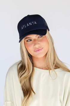 Calling all Braves fans, the Navy Atlanta Trucker Hat was made just for you! This cute hat is made of a soft cotton construction with a mesh back. It has a rounded top and a slightly rounded brim with "Atlanta" on the front! Adjustable Strap Spot Clean with Damp Cloth or Sponge One Size Fits Most Black Sunglasses Square, Cute Hat, Exclusive Dress, The Navy, Cute Hats, Black Square, White Midi Dress, Navy Blue Dresses, Heart Earrings Studs