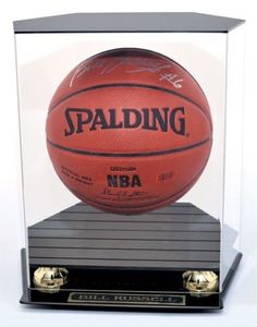 an autographed basketball in a glass case on top of a black base stand