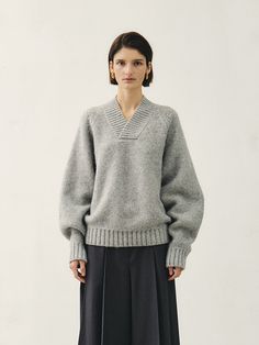 Editor's NotesMohan is a compound word that means MODERATION HANDLING - dealing with moderation. Mohan's basic philosophy is Maximize Minimal. It expresses the feminine neutral aspect in a calm and restrained design based on classical elements. We prioritize communication of various thoughts based on a broad spectrum of research rather than personal inspiration and intuition.- This is a cozy V-neck knit sweater made from a blend of alpaca and wool materials. - It provides a warm feeling, thanks to the use of long-fibered yarn, making it suitable for wearing even in the coldest winter months. - The thick yarn and oversized silhouette allow for comfortable wear. - This product is available in two sizes: S and M.Measurements(in.)Size: One size ( XS - M )- Shoulder:35.83/36.22  in.- Chest Knitwear Fashion Design, Modern Knitwear, Sweater Oversize, Thick Yarn, Thick Sweaters, Knitwear Fashion, W Concept, Sweater Making, Winter Knits