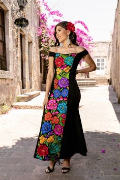 This Beautiful Mexican Floral Dress is the perfect dress for a special event or Mexican Fiesta. It reflects the Mexican culture through its unique embroidered design and vibrant colors. It closes with a zipper on the back for a secure and comfortable fit.  It is embroidered by Artisanal Machine- hand manipulated by Mexican Artisans in Guanajuato, Mexico. It's made out of spandex and is full of embroidered multicolor flowers. Size S - 2X Shop more Mexican Dresses here:  https://www.etsy.com/es/sh Embroidered Dresses With Fitted Bodice For Gala, Embroidered Dress With Fitted Bodice For Gala, Embroidered Gala Dresses With Fitted Bodice, Embroidered Floor-length Dress For Celebration, Fitted Floral Embroidered Maxi Dress For Gala, Fitted Gown With Multicolor Embroidery, Fitted Multicolor Embroidered Wedding Dress, Fitted Floor-length Gown With Multicolor Embroidery, Fitted Wedding Dress With Multicolor Embroidery