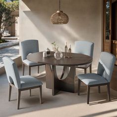 a dining table with four chairs around it