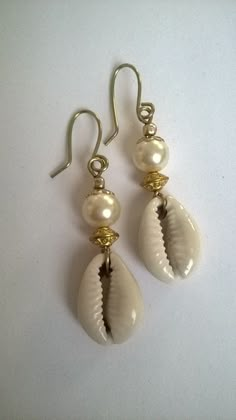 Classy Cowie Shell Earrings. A classy twist on a old favorite. Comes in Black, Sliver with Brass or Silver metal  accents. 2 inches long and can be converted to clip please note in order. Elegant Beach Earrings With Wire Wrapped, Elegant Wire Wrapped Earrings For Beach, Elegant Nickel-free Hoop Earrings For Beach, Elegant Nickel-free Beach Earrings, Elegant Nickel-free Earrings For The Beach, Cowie Shell, Cowrie Jewelry, Shells Art, Shell Craft