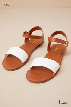 Get back to basics in the Insta-worthy Lulus Hearts and Hashtags White and Tan Flat Sandals! You can wear these faux leather sandals anywhere, with their simple white toe band and contrasting tan ankle strap with a gold buckle. 0. 25" rubber heel. Smooth synthetic insole. Nonskid rubber sole. All Man Made Materials. Imported. Lulus | Hearts and Hashtags White and Tan Flat Sandal Heels. White Flat Sandals, White Strappy Sandals, Tan Flats, White Flat, Sandal Heels, Back To Basics, White Flats, Simple White, Rubber Heels