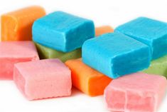 several different colored marshmallows sitting on top of each other