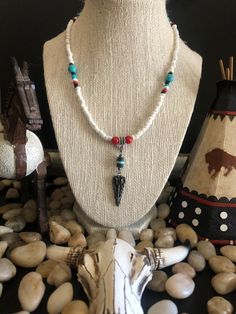 Native American style necklace. Made to order with 6/0 White Seed beads, turquoise and red coral semiprecious stones. 20 inches long on a wire. White Gemstone Beads Jewelry For Festival, Traditional White Necklaces With Natural Stones, Bohemian White Turquoise Necklace As Gift, White Bohemian Turquoise Necklace As Gift, White Spiritual Jewelry For Festival, Spiritual White Jewelry For Festival, Southwestern Style White Jewelry With Dangling Beads, Bohemian Howlite Beaded Necklace With Gemstone Beads, Bohemian Howlite Gemstone Beaded Necklaces