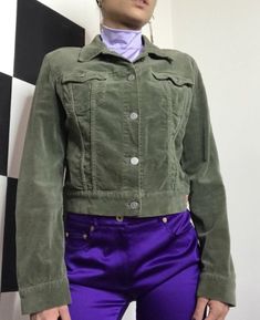 Fiorucci Safety Jeans Jacket velvet olive green size S/M. Authentic Item. Perfect condition. Fresh from laundry. 2 front pockets. Silver logo buttons. Vintage. 98%cotton 2%elastane Width 43 cm Lenght 49 cm Fitted Green Utility Jacket With Pockets, Fitted Green Utility Jacket With Long Sleeves, Fitted Green Long Sleeve Utility Jacket, Green Cotton Utility Jacket With Buttons, Fitted Green Cotton Outerwear, Trendy Green Button-up Utility Jacket, Trendy Green Utility Jacket With Button Closure, Trendy Green Utility Jacket With Pockets, 90s Style Green Outerwear With Pockets