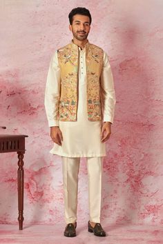 Mustard bundi with all over kantha stitch embroidery in floral and bird motifs. Paired with an inner cream kuta and pyjama set. - Aza Fashions Kantha Stitch Embroidery, Kurta Set Men, Kurta Set For Men, Nehru Jacket, Bird Motif, Kantha Stitch, Kuta, Silk Embroidery, Kurta Set