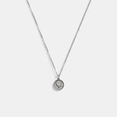 Part of our Men’s Jewelry Collection this long sterling silver chain necklace features a coin pedant detailed with Coach mascot Rexy. It’s finished with an easy clasp closure. | Coach Sterling Silver Coin Pendant Necklace Silver Sterling Silver Coin Necklace With Delicate Chain, Minimalist Silver Coin Necklace With Delicate Chain, Sterling Silver Pendant Coin Necklace With Delicate Chain, Silver Medallion Coin Necklace With Delicate Chain, Everyday Silver Engraved Coin Necklace, Silver Coin Necklace With Delicate Chain For Gift, Everyday Silver Medallion Necklace, Sterling Silver Medallion Coin Necklace With Chain, Sterling Silver Medallion Necklace With Coin Pendant For Everyday