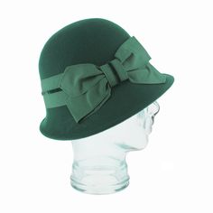 The Belfry Ardea is a classic 1920s cloche featuring a flattering asymmetrical brim and a velvet accented grosgrain ribbon band. Expertly crafted with vintage details, this hat is the perfect addition to any outfit! Its unique design adds a touch of elegance and sophistication whether you opt for the brilliant accent of green or keep it sleek with its timeless black option, making it a must-have for any fashion-forward individual. FEATURESStyle: ClocheMaterial: 100% WoolBand: 2" Grosgrain Ribbon Classic Fall Formal Cloche Hat, Fitted Solid Cloche Hat, Fitted Solid Color Cloche Hat, Classic Spring Cloche Hat, Formal Adjustable Wool Cloche Hat, Winter Party Classic Cloche Hat, Classic Fitted Cloche Hat For Fall, Classic Adjustable Cloche Hat, Formal Wool Cloche Hat With Adjustable Fit