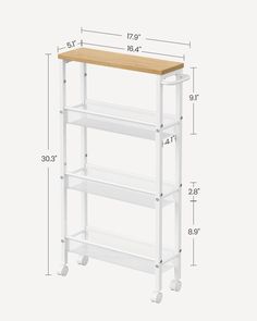 a white shelf with three shelves on each side and measurements for the height of it