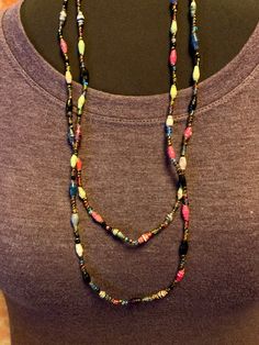 Colorful lightweight single strand necklace shown here doubled over.  Larger beads appear to be made from varnished paper. Skull Pendant, Unique Gifts For Her, Bead Leather, Beaded Necklaces, Yellow Diamond, Strand Necklace, Pearl Pendant, Diamond Pendant, Making Ideas