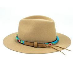 Price includes a Lola Sambboho hat & a Blue Vogue hatband. Save 10% with this bundle. Select hat size. Hatband is one size fits all. Hatband is removable. An iconic must-have Fedora hat that will never get out of fashion. Sambboho's Lola hat has a soft brim and indented crown. A chic piece to be worn at all seasons of the year. The timelessness chic and sophistication exuded by this hat make it a lifetime wardrobe investment you’ll never regret! Classic Fedora design in Sand color Trimmed wi Never Regret, Seasons Of The Year, Sand Color, Hat Band, Fedora Hat, Hat Making, Hat Sizes, One Size Fits All, Fedora