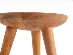 a wooden stool that is made out of wood and has two legs on each side