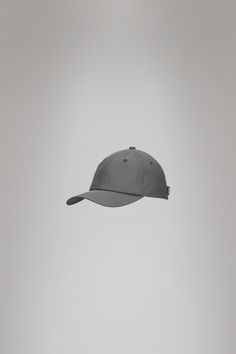 Cap is Rains' take on the classic baseball cap with 6 panels and curved brim. The Cap is characterized by a curved brim and six-paneled design held in place by a back-mounted adjustable webbing strap and buckle. It features eyelets to ensure ventilation for breathable comfort. Cap is cut from Rains' signature PU fabric. The finish is lightweight with a smooth feel. Pu Fabric, Webbing Strap, Visa Mastercard, Baseball Cap, Cape, Buckle, Baseball, Band, Grey