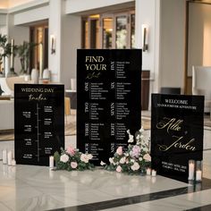 a black and white wedding seating plan with flowers on the table in front of it