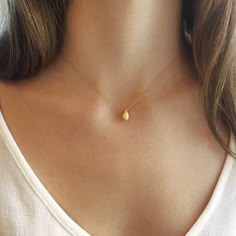 "A small vermeil golden nugget adorns this simple, dainty gold chain. Perfect for everyday wear, this simple necklace is the perfect piece to layer with other necklaces. All necklaces are finished with a tiny fresh water pearl at each chain ending beside the clasp. //GET THE LOOK// >> Model is wearing a 16\" gold nugget necklace in the 1st photo. >> 4th photo, model is wearing an 18\" nugget necklace layered with a 16\" citrine gemstone necklace, spaced 2 inches apart. >> 5th p Gold Jewelry Simple Necklace Pendants, Simple Gold Necklace, Necklaces Simple, Dainty Gold Chain, Golden Nugget, Gold Necklace Simple, Nugget Necklace, Small Necklace, Necklace Layered