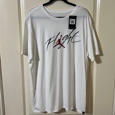 Jordan Flight T-Shirt Size Xxl Nwt White Graphic Tee For Sports, White Crew Neck Shirt With Logo Print, Sporty White Print Short Sleeve Top, White Relaxed Fit Sporty Shirt, White Short Sleeve Tops With Logo Print, White Short Sleeve Top With Logo Print, White Graphic Print Sports Shirt, White Graphic Print Shirt For Sports, White Sporty Crew Neck Shirt