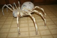 a spider made out of toilet paper on the floor