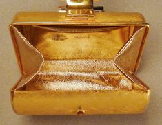 An elegant early vintage Rodo, Italy, evening bag -minaudiere in textured brushed gold tone metal clamshell design as you can see from the pictures. It is in excellent hardly used condition and lined with gold colored leather. It is signed Rodo Italy with a nicely working belt buckle look snap closure . It measures 5 1/2 inches long by 2 1/2 inches wide and is 3 3/4 inches tall, An elegant collectible designer Rodo Italy early vintage minaudiere addition for your holiday ensemble! Italy Evening, Vintage App, Colored Leather, Chicago Il, Vintage Bags, Belt Buckle, Gold Tone Metal, Belt Buckles, Evening Bags