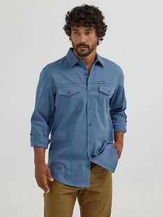 Wherever you go, the Men’s Wrangler® Outdoor Utility Shirt has your back. It’s crafted from a comfortable cotton blend made even better with built-in UV protection from the sun’s harmful rays and a moisture-wicking finish to keep you feeling dry. This long-sleeve collared shirt comes with two chest flap pockets, a full metal button closure, and a convertible sleeve system so you can adapt your look on the fly. It also features a regular fit that works on its own or layered. Cotton Camp Shirt With Pockets For Outdoor Activities, Cotton Camp Shirt With Relaxed Fit For Outdoor, Relaxed Fit Cotton Camp Shirt For Outdoor, Relaxed Fit Cotton Camp Shirt For Outdoor Activities, Rugged Outdoor Shirt With Relaxed Fit, Rugged Relaxed Fit Shirt For Outdoor, Rugged Cotton Outdoor Shirt, Bering Sea, Utility Shirt