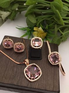 Material:  brass, Cz Stone. Gorgeous Rose gold Combo of Ring, Pendant with Chain and Matching Earrings and matching Bracelet. You can wear this with any kind of outfits like Kurtis, lehanga, Sarees and Trousers and Denims. Most eligible gift for someone you love and someone very special for you. Best gift for your anniversary. Best gift for her Birthday. Pendant : 1 Earrings : 1 pair Bracelet : 1 Ring : 1 Chain : 1 Arrives in a small plastic box. For any queries please contact me. Birthday Pendant, Sabyasachi Jewellery, Bollywood Jewelry, Bracelet Ring, Best Gifts For Her, Gift For Her Birthday, Pendant With Chain, Fancy Jewellery, Matching Bracelet