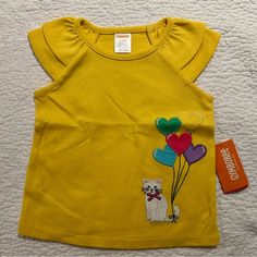 Beautiful Gymboree T-Shirt Size: 12 / 18 Months New, Never Used Cute Yellow T-shirt For Playtime, Spring Crew Neck Tops For Playtime, Crew Neck Tops For Playtime In Spring, Crew Neck Tops For Spring Playtime, Yellow Playful Tops For Playtime, Playful Yellow Tops For Playtime, Spring Graphic Tee Tops For Playtime, Spring Playtime Graphic Tee Tops, Kids Shirts